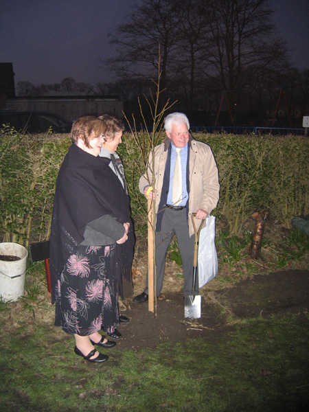 Roy Lancaster planting the commemorative tree